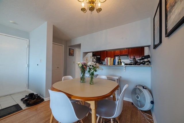 dining area with light wood-type flooring