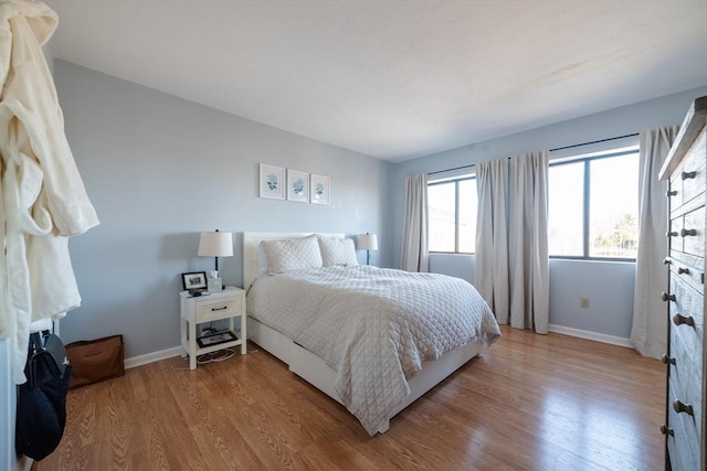 bedroom with light wood-type flooring