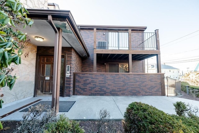 view of front of house featuring a balcony