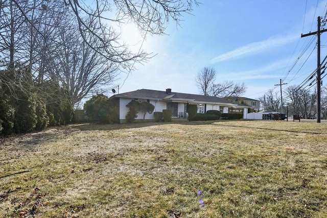 ranch-style house with a front lawn