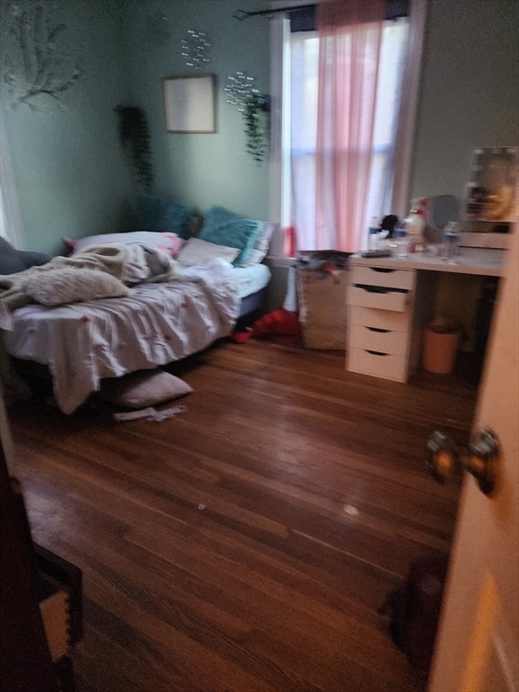 bedroom featuring dark wood-type flooring