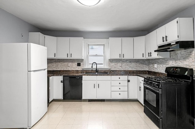 kitchen with black appliances, dark countertops, under cabinet range hood, and a sink