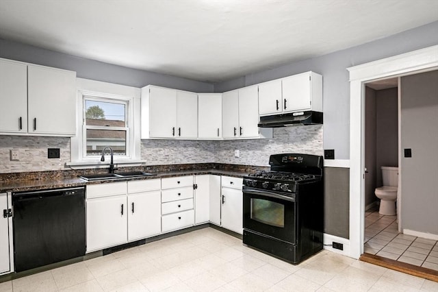 kitchen with a sink, under cabinet range hood, black appliances, dark countertops, and white cabinets