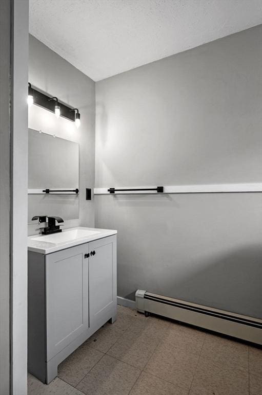 bathroom featuring vanity and a baseboard radiator