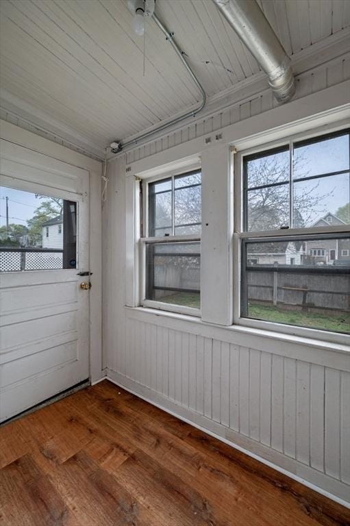 unfurnished sunroom featuring a wealth of natural light