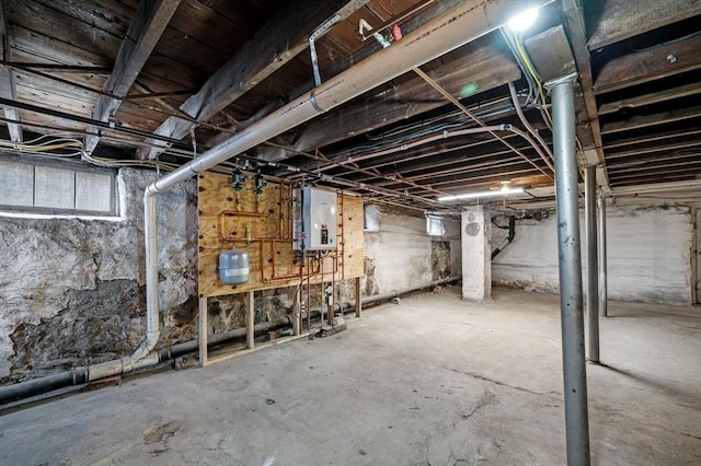 unfinished basement featuring electric panel