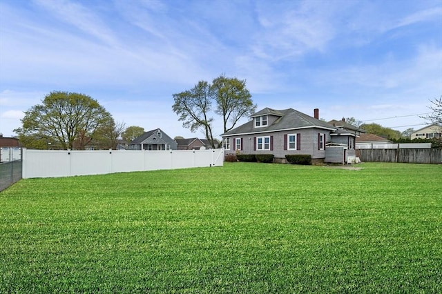 view of yard with a fenced backyard
