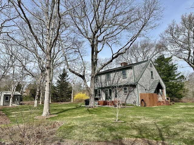 32 Machipscat Trl, West Tisbury, MA 02575 - exterior space with a yard, a chimney, and an outbuilding