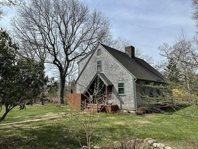 32 Machipscat Trl, West Tisbury, MA 02575 - view of side of home with a shingled roof, a yard, and a chimney