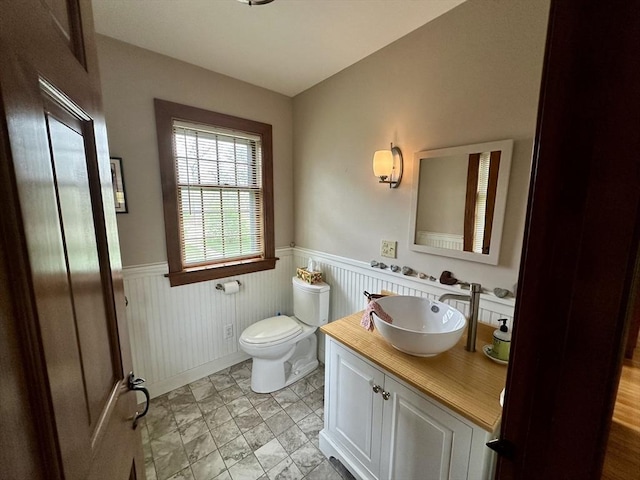 32 Machipscat Trl, West Tisbury, MA 02575 - bathroom with a wainscoted wall, toilet, and vanity