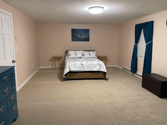 bedroom featuring light colored carpet, baseboards, and a baseboard heating unit
