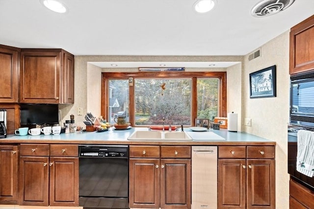 26 Mordecai Lincoln Rd, Scituate, MA 02066 - kitchen featuring black appliances, a sink, light countertops, brown cabinetry, and recessed lighting