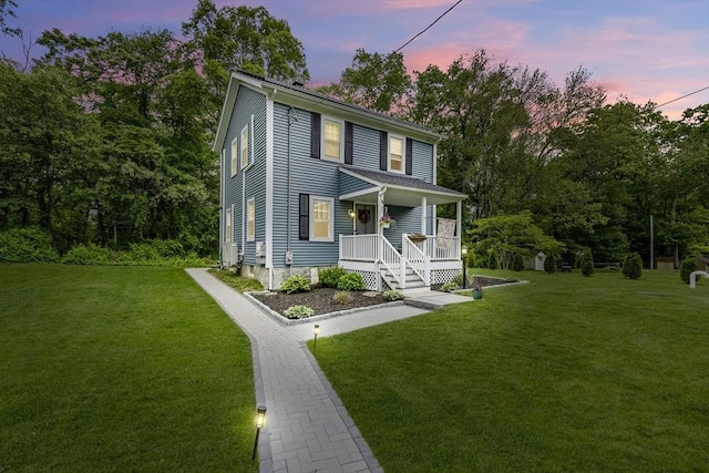78 Conserve Ave, Westport, MA 02790 - view of front of house featuring covered porch and a front lawn