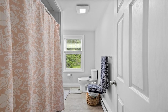 78 Conserve Ave, Westport, MA 02790 - full bath with toilet, baseboards, wood finished floors, baseboard heating, and a shower with shower curtain