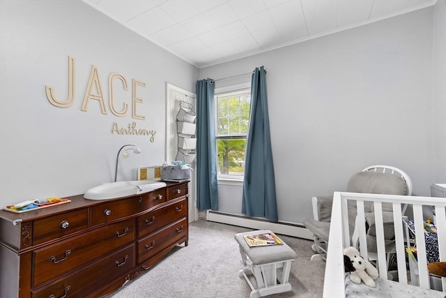 78 Conserve Ave, Westport, MA 02790 - bedroom with crown molding, light colored carpet, a baseboard radiator, and a crib