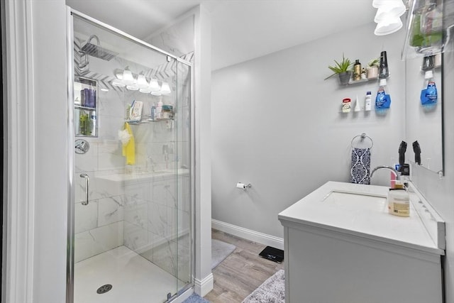 78 Conserve Ave, Westport, MA 02790 - bathroom with a shower stall, wood finished floors, vanity, and baseboards
