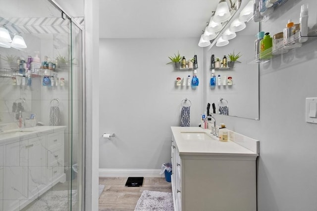 78 Conserve Ave, Westport, MA 02790 - bathroom featuring vanity, wood finished floors, a shower stall, and baseboards