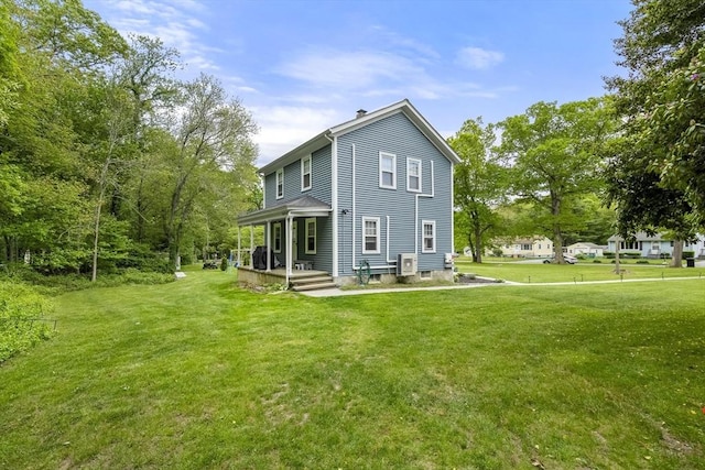 78 Conserve Ave, Westport, MA 02790 - rear view of property with a yard and a chimney