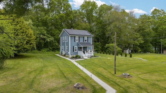 78 Conserve Ave, Westport, MA 02790 - view of front facade with covered porch, solar panels, and a front yard