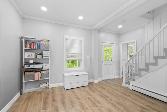 78 Conserve Ave, Westport, MA 02790 - entrance foyer with baseboard heating, wood finished floors, ornamental molding, stairs, and baseboards