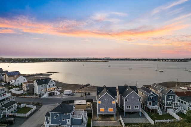 aerial view at dusk with a water view