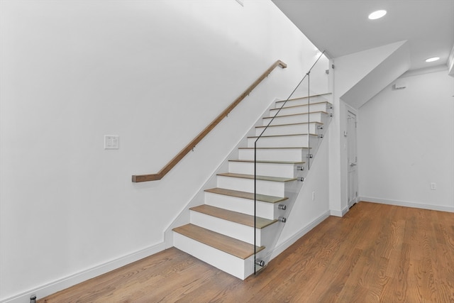 stairway with wood-type flooring