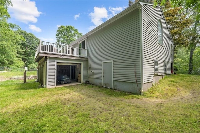 9 Oak Hill Rd, Mendon, MA 01756 - back of property featuring a yard, driveway, and a garage