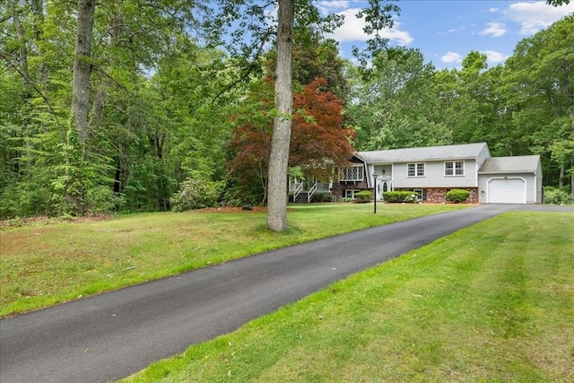 9 Oak Hill Rd, Mendon, MA 01756 - raised ranch featuring driveway, an attached garage, and a front yard
