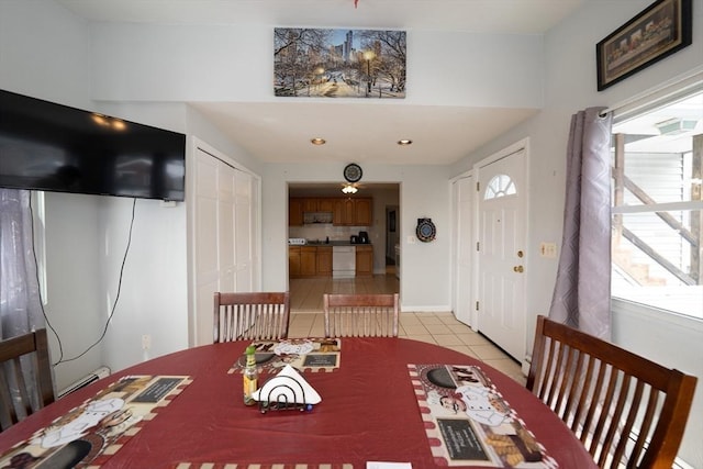 dining area featuring light tile patterned floors, baseboards, and recessed lighting