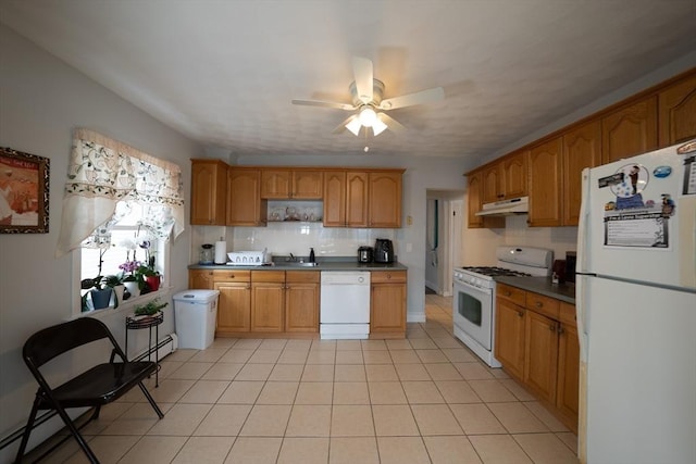 kitchen with light tile patterned floors, ceiling fan, under cabinet range hood, white appliances, and tasteful backsplash