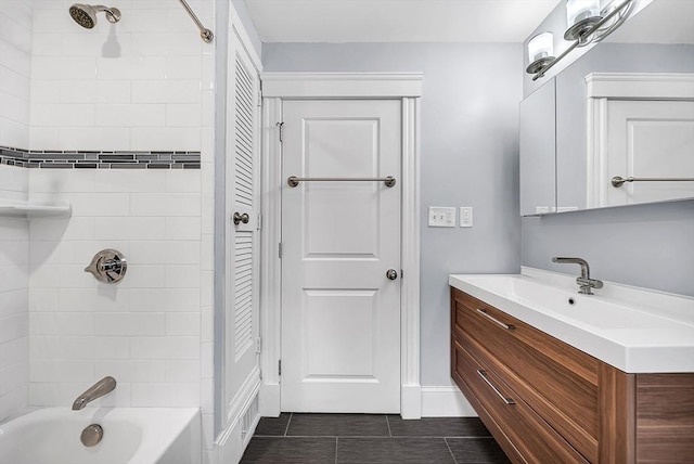 39 Madison St Unit 2, Somerville, MA 02143 - bathroom with tile patterned flooring, vanity, shower / bathtub combination, and a closet