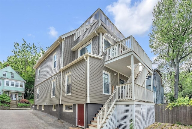39 Madison St Unit 2, Somerville, MA 02143 - view of property exterior featuring a balcony and stairs