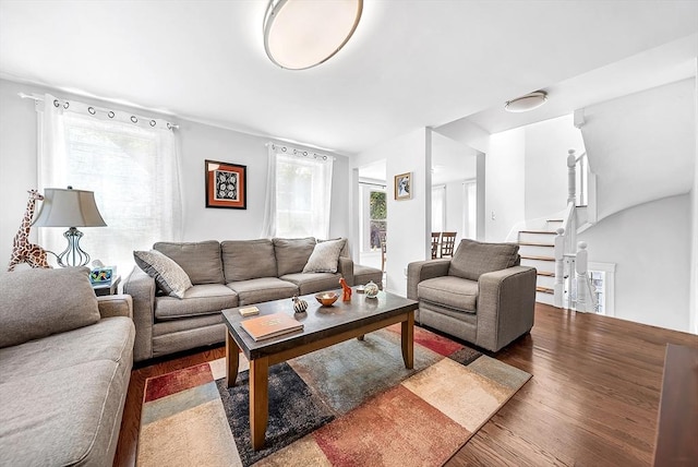 39 Madison St Unit 2, Somerville, MA 02143 - living room featuring healthy amount of natural light, wood finished floors, and stairway