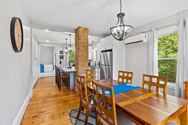 12 Russell St, Amesbury, MA 01913 - dining room with a chandelier, a wall mounted air conditioner, light wood-style floors, plenty of natural light, and recessed lighting