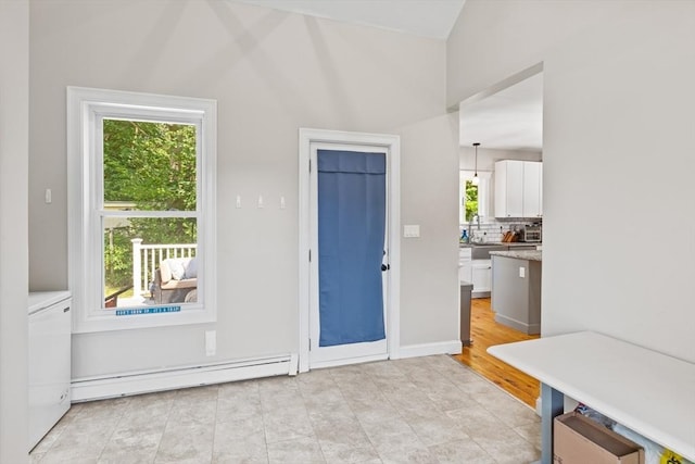 12 Russell St, Amesbury, MA 01913 - entryway featuring a baseboard heating unit and vaulted ceiling