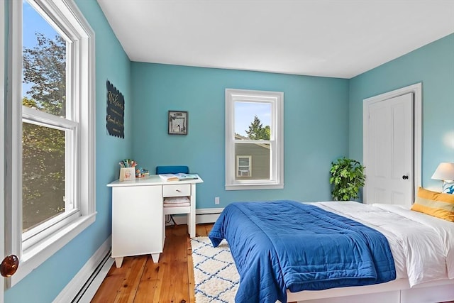 12 Russell St, Amesbury, MA 01913 - bedroom with a baseboard radiator and wood finished floors