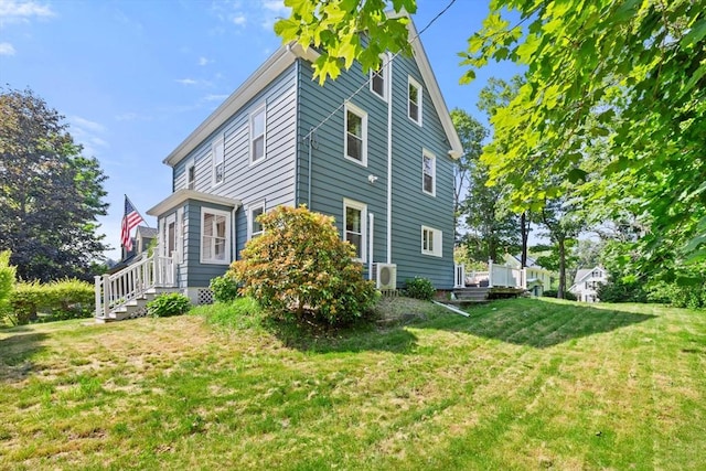 12 Russell St, Amesbury, MA 01913 - view of property exterior with a yard and an ac unit