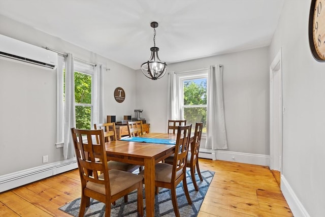 12 Russell St, Amesbury, MA 01913 - dining room featuring a wall mounted air conditioner, plenty of natural light, and light wood finished floors
