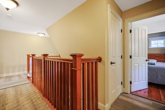 hall with hardwood / wood-style floors