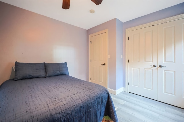 bedroom with ceiling fan and light wood-type flooring