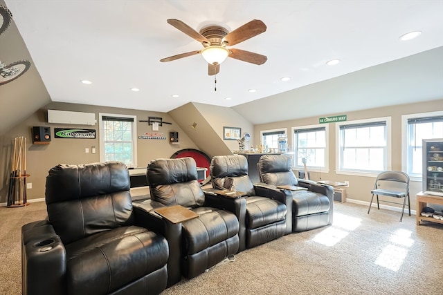 carpeted home theater featuring lofted ceiling and plenty of natural light