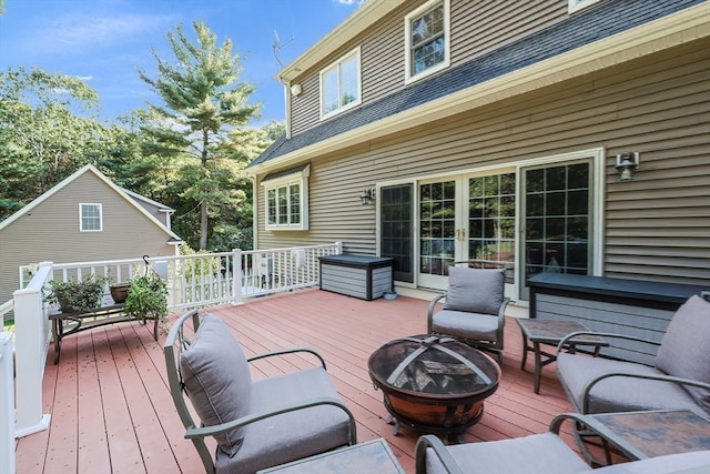 wooden terrace with a fire pit