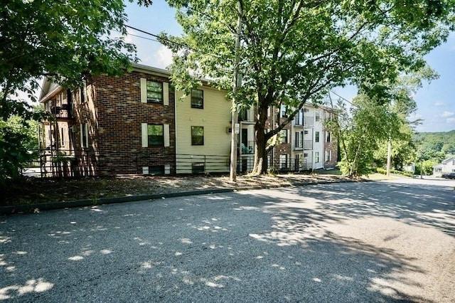 exterior space featuring brick siding