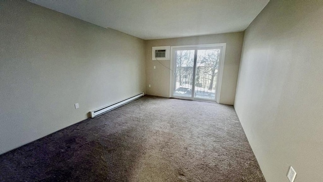 unfurnished room with baseboard heating and carpet