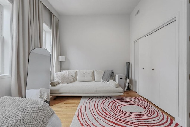 interior space featuring visible vents and wood finished floors