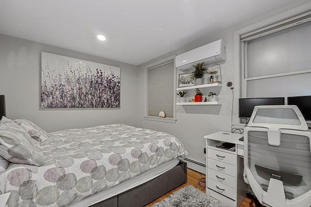 bedroom featuring recessed lighting, a wall mounted AC, wood finished floors, and a baseboard radiator