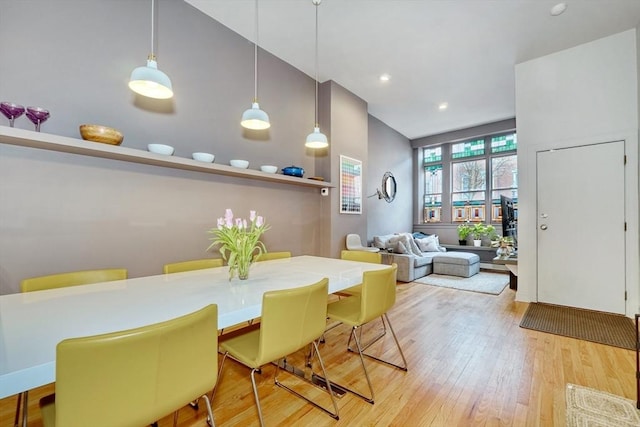 dining area featuring recessed lighting and light wood-style flooring
