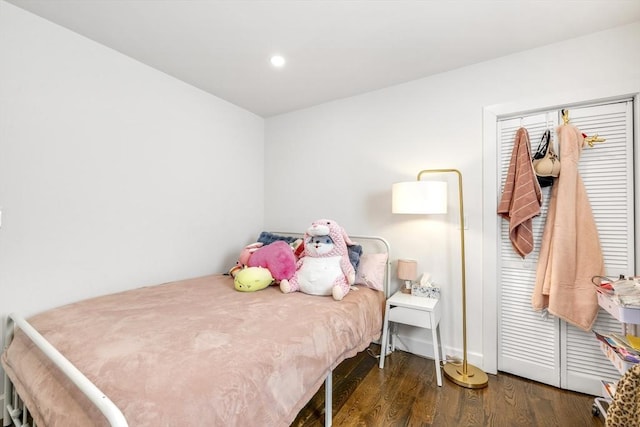 bedroom with wood finished floors and recessed lighting