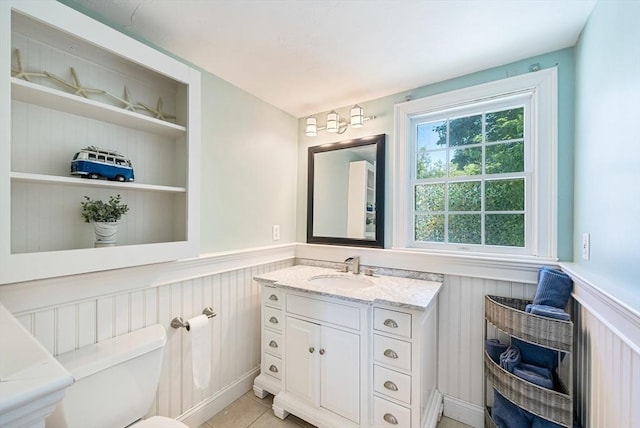328 Central Ave, Scituate, MA 02050 - bathroom featuring a wainscoted wall, vanity, built in features, and tile patterned floors