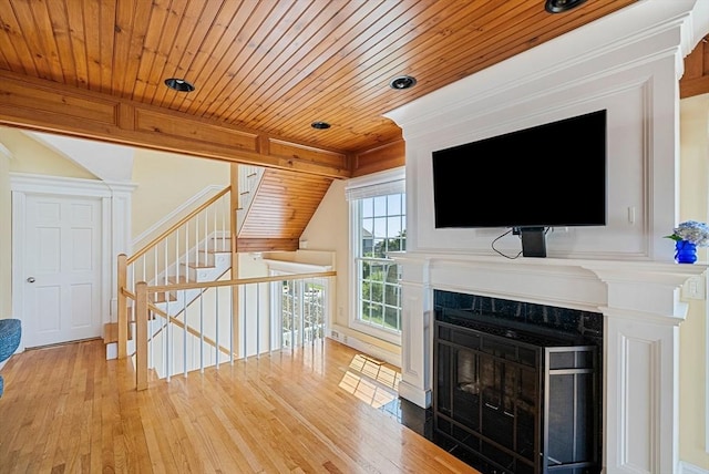 328 Central Ave, Scituate, MA 02050 - unfurnished living room featuring hardwood / wood-style floors, wood ceiling, and a fireplace with flush hearth